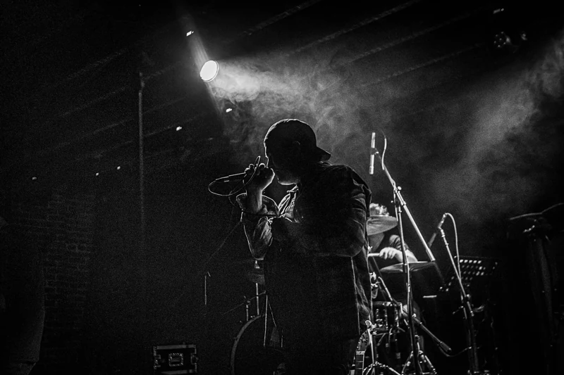 The Faithfull on stage in black and white