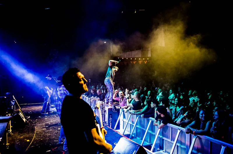 The Faithfull performing under blue and yellow stage lights