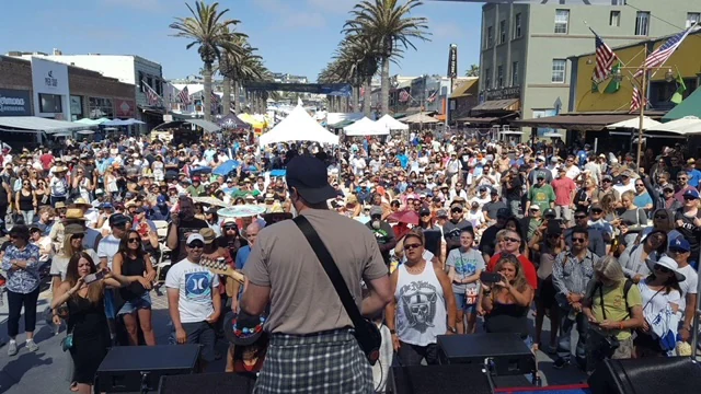 Outdoor concert crowd viewed from the stage